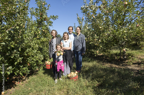 Family of five apple picking