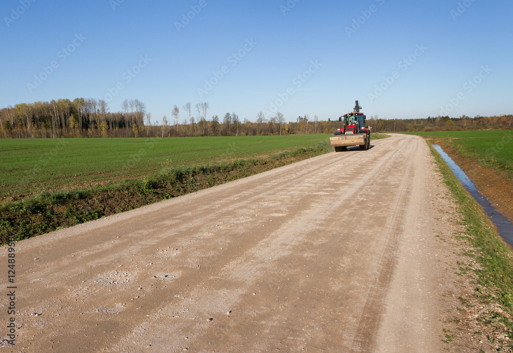 Tractor on country road.