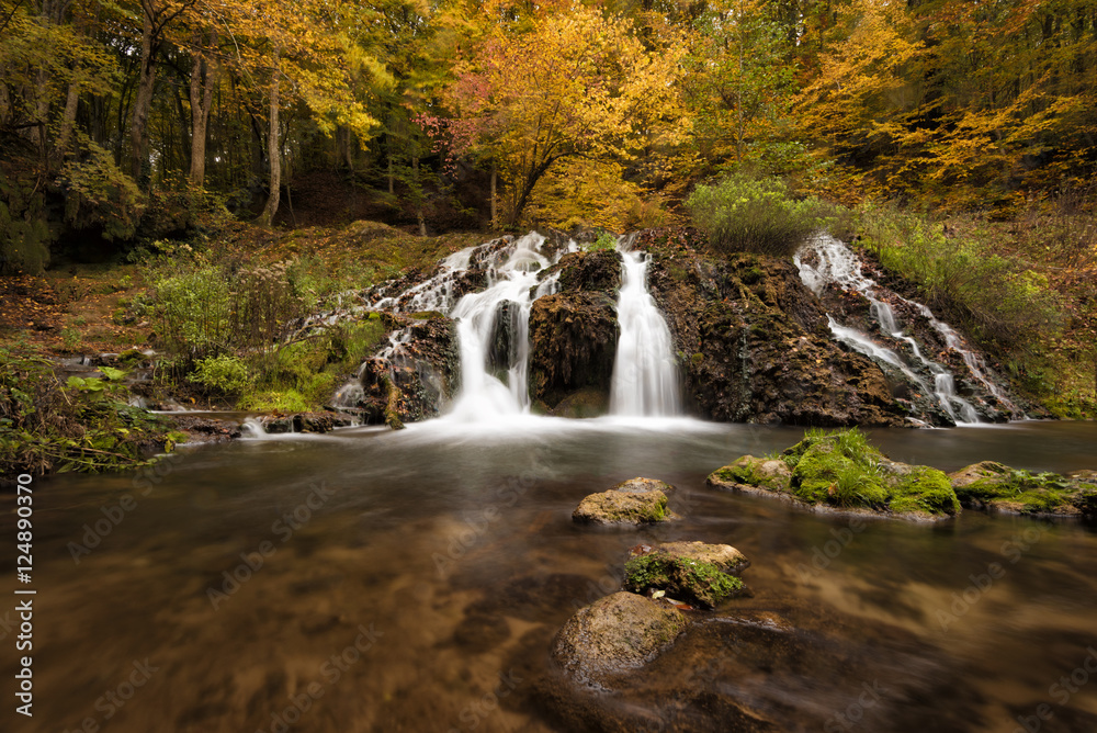 Dokuzak waterfall in Strandja mountain, Bulgaria during autumn. Beautiful view of a river with an waterfall in the forest. Autumn landscape