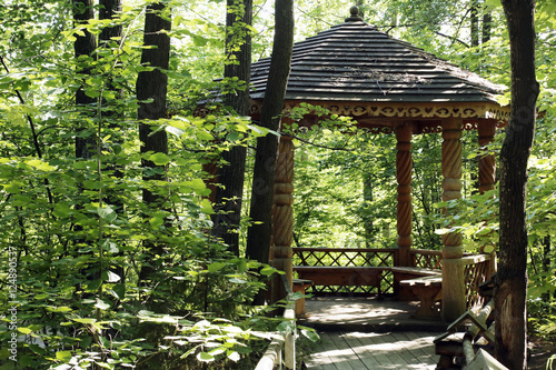 Wooden gazebo in the woods