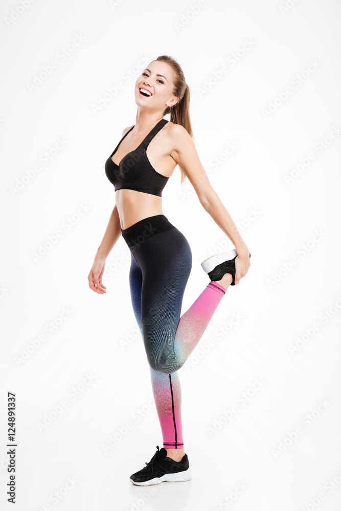 Portrait of a beautiful fitness woman doing stretching exercises Portrait of a beautiful fitness woman doing stretching exercises
