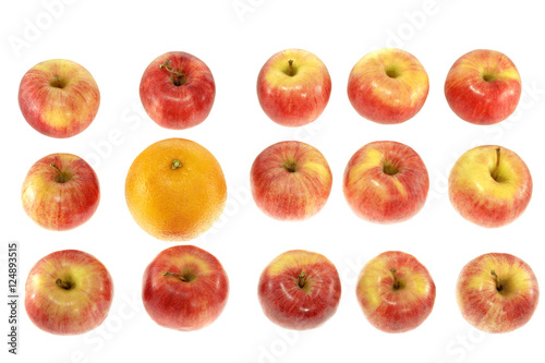 one large orange and red apples