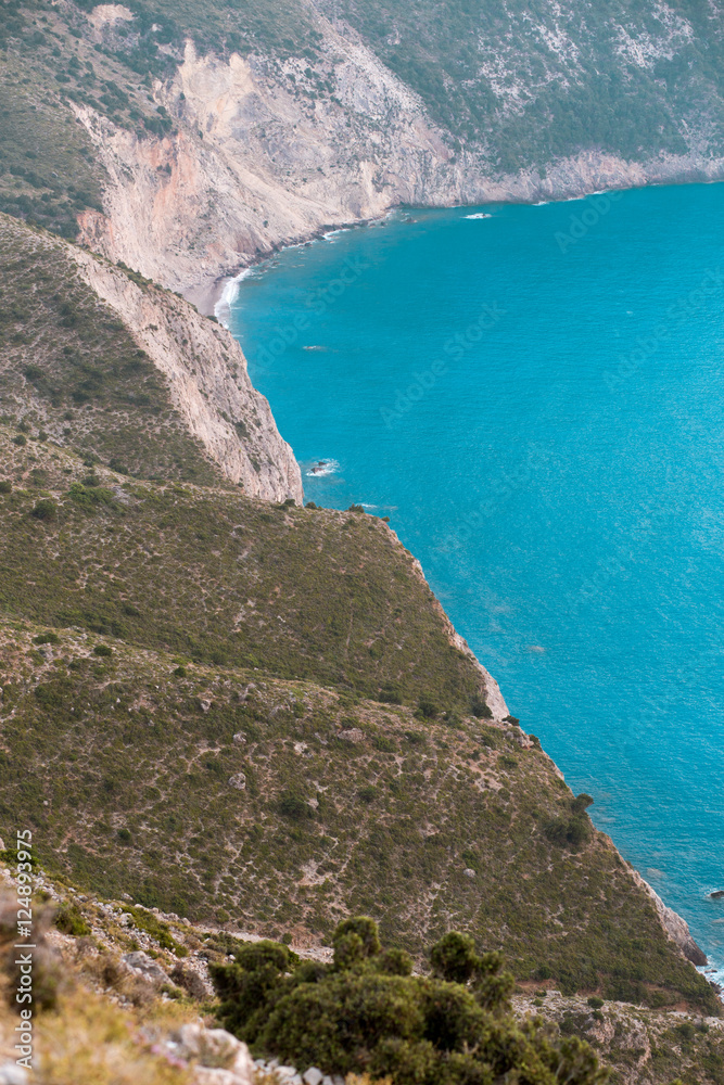 Coastline of island with turquoise and clear water in greek island