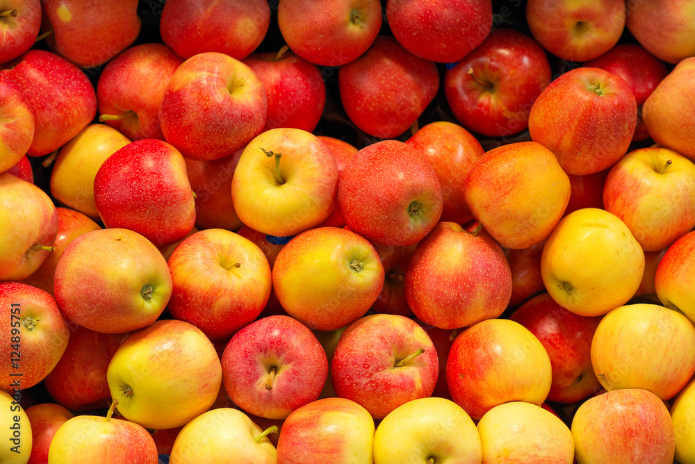 Lots of bright apples in supermarket.