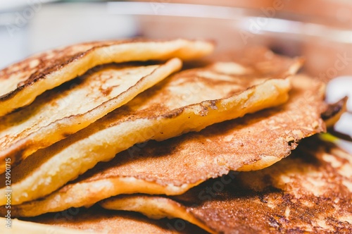 Pile of delicious american pancakes close up