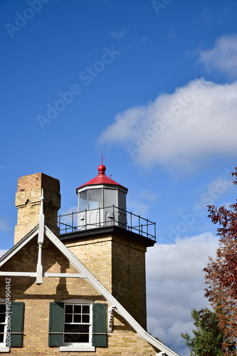 Wallpaper Mural Historic lighthouse with red top and blue sky and clouds Torontodigital.ca