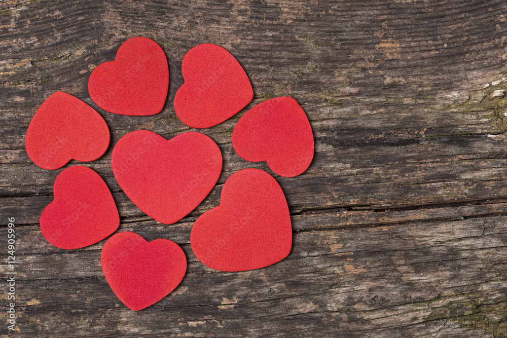 Obraz premium Read heart on wooden background.Valentines Day background with hearts.