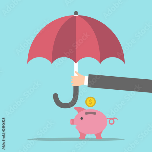Hand protecting piggy bank