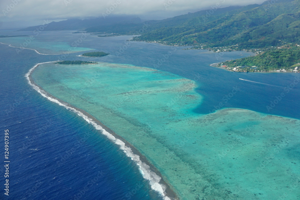 The lagoon and barrier reef of Raiatea island, aerial view, south Pacific ocean, Society islands, French Polynesia
