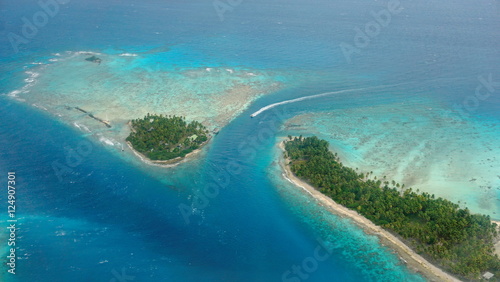 Aerial view of tropical islet with lagoon and channel, Avatoru pass, atoll of Rangiroa, Tuamotu archipelago, French Polynesia
 photo