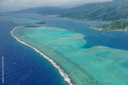 The lagoon and barrier reef of Raiatea island, aerial view, south Pacific ocean, Society islands, French Polynesia 