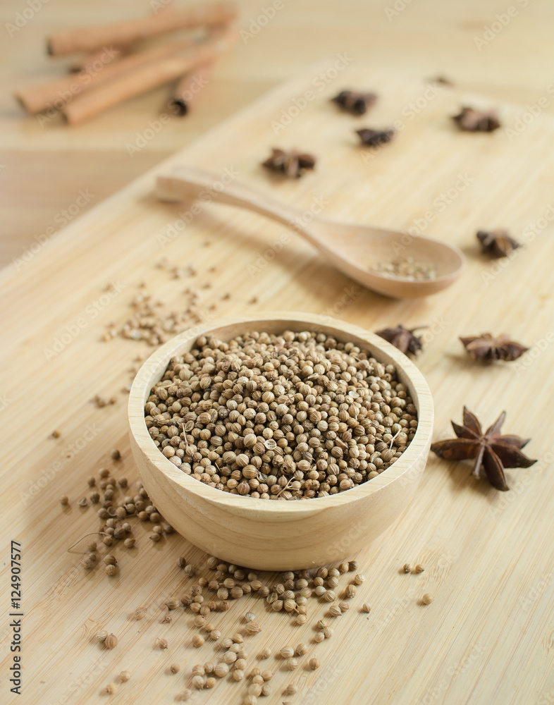 Coriander seeds in wooden bowl and on twooden board. Coriander seeds in wooden bowl and on twooden board.