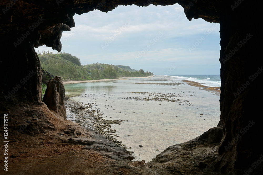 Viewpoint on the sea shore from a cavern entrance, Rurutu island, Pacific ocean, Austral archipelago, French Polynesia
