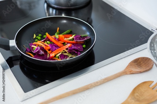 Food on a induction cooktop in kitchen
