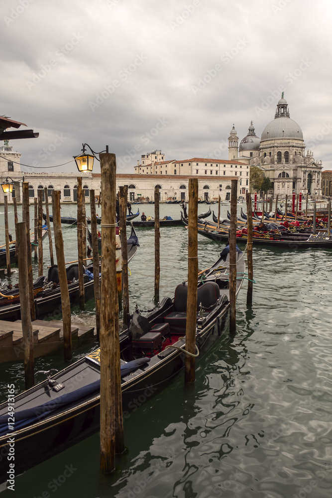 Traditional Venetian gondola - with Santa Maria della Salute church, Venice, Italy