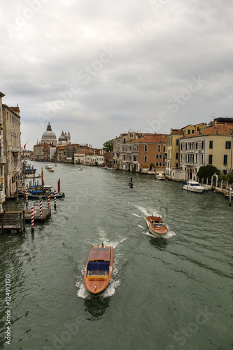 View from Academia bridge on Grand Canal and Basilica Santa Maria della Salute and cruise ship, Venice, Italy 
