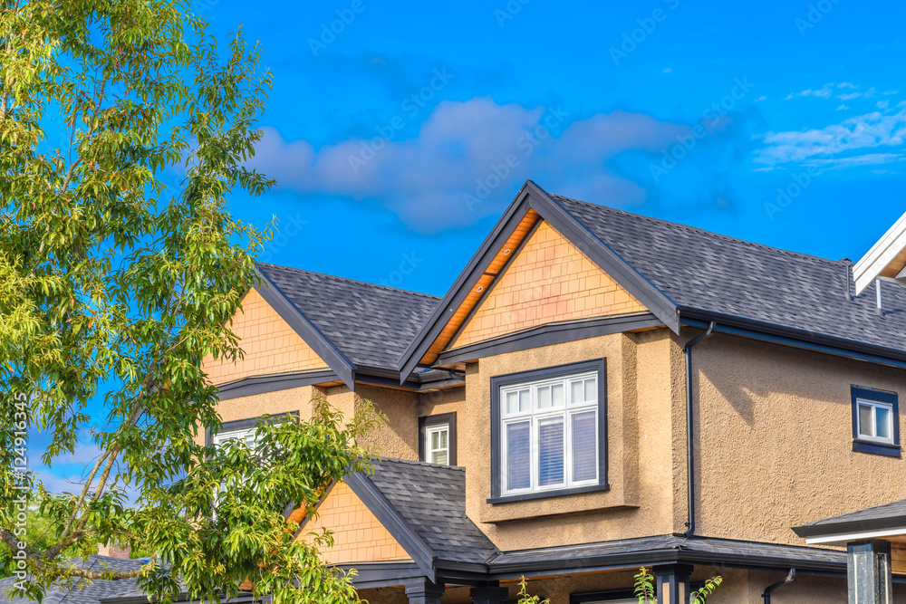 The top of the house or apartment building with nice window.