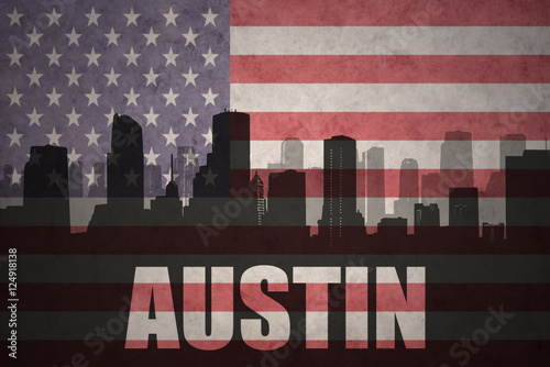 abstract silhouette of the city with text Austin at the vintage american flag