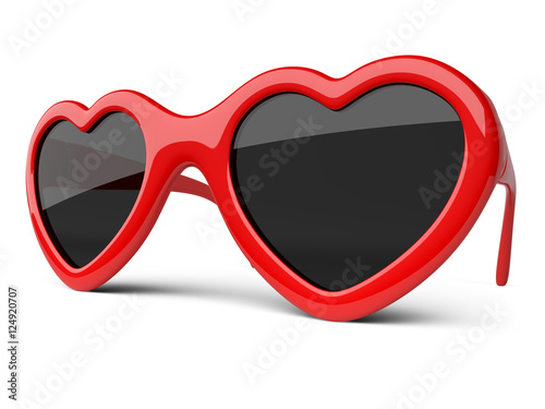 Red colored glasses in a form heart. Happiness and love concept.
