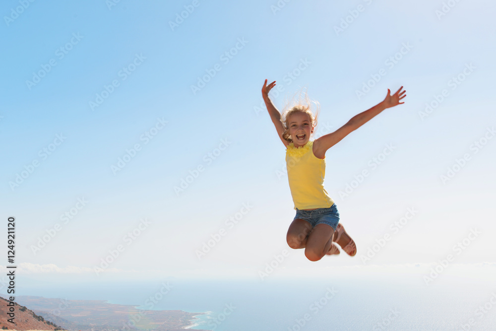 girl on top of mountain