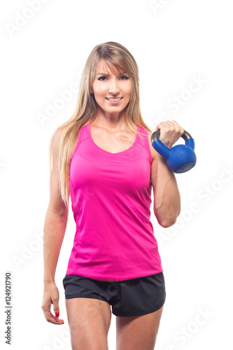 Fitness woman exercising crossfit holding kettlebell strength tr © satyrenko