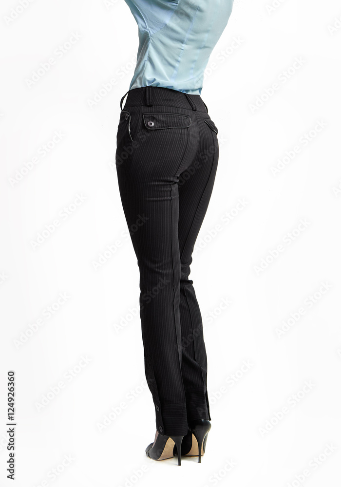 Fashion female concept. Woman full length in trousers high heels shoes classical style. Back view, isolated on white background Fashion female concept. Woman full length in trousers high heels shoes classical style. Back view, isolated on white background