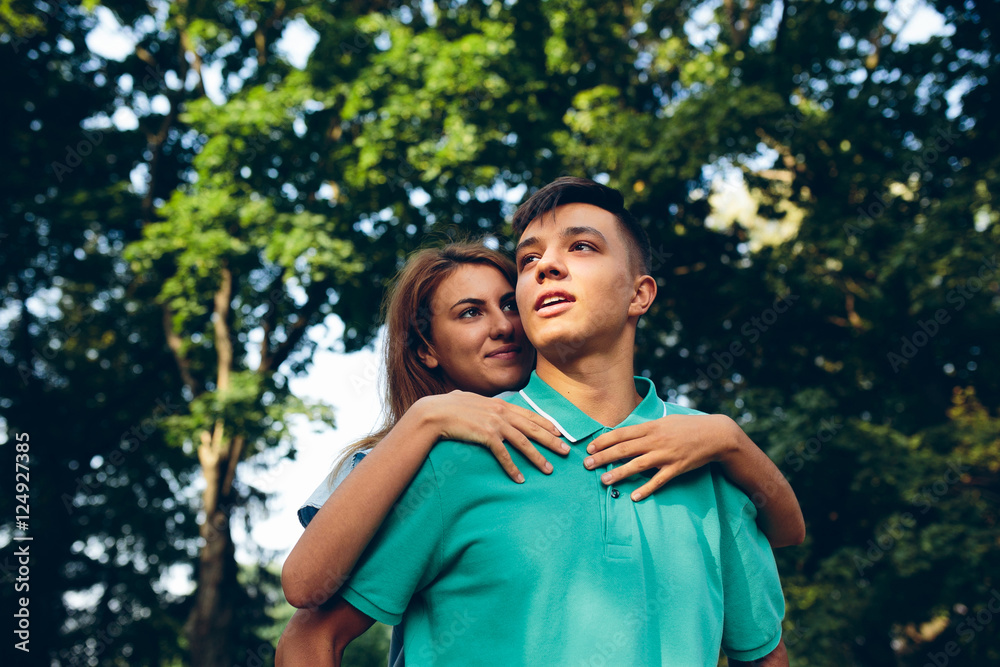 man carries a girl on his back