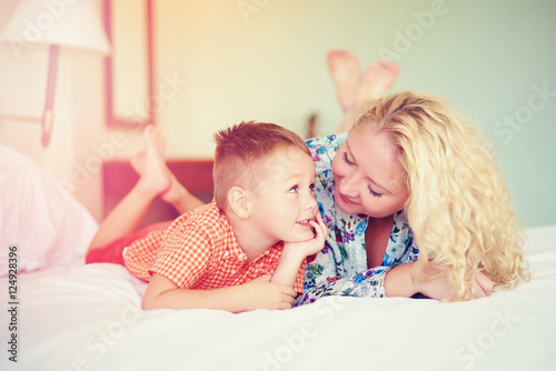 happy mother and son talking at home