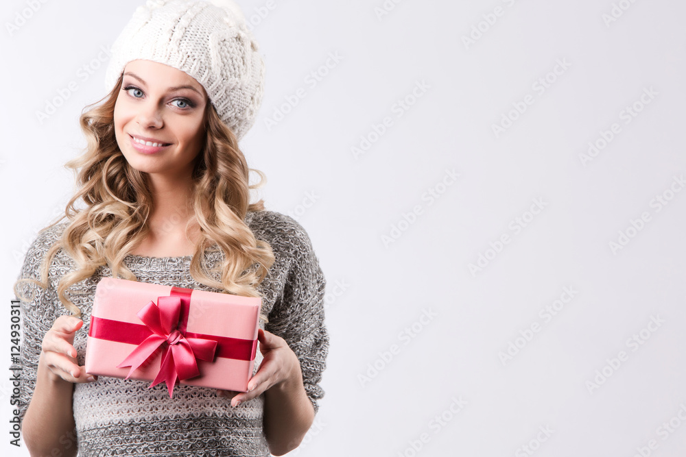 Happy woman holding gift box, isolated on white background. Happy woman holding gift box, isolated on white background.
