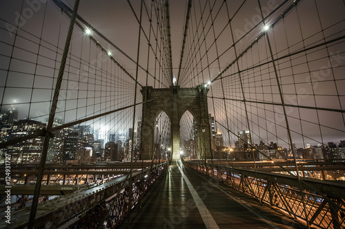 Brooklyn Bridge during a foggy night in New York