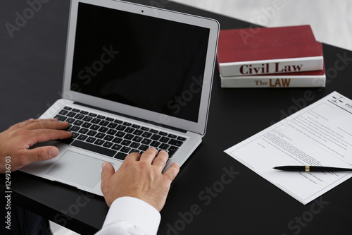 Man working with laptop in ...