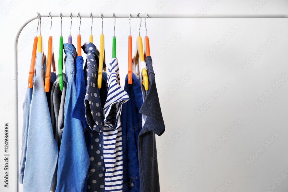 Fototapeta premium Clothes hanging on rack, closeup