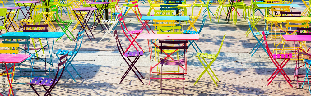square filled with colorful tables and chairs square filled with colorful tables and chairs