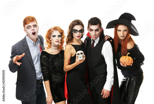 Young people dressed in different costumes for Halloween, isolated on white