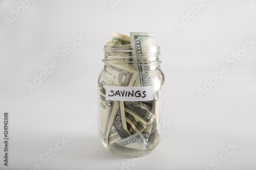 Closeup of Mason jar with money for savings photo