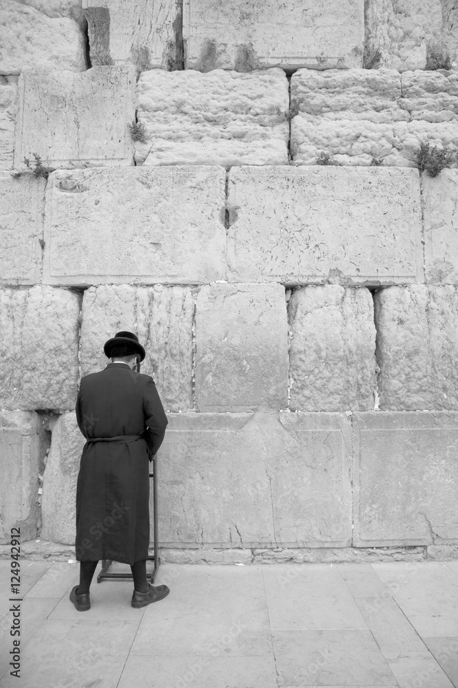 man praying at wall 1 bw man praying at wall 1 bw
