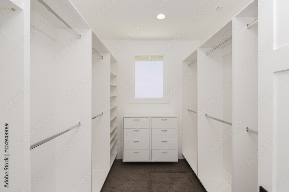 Big empty walk in wardrobe / closet in luxurious house. Big empty walk in wardrobe / closet in luxurious house.
