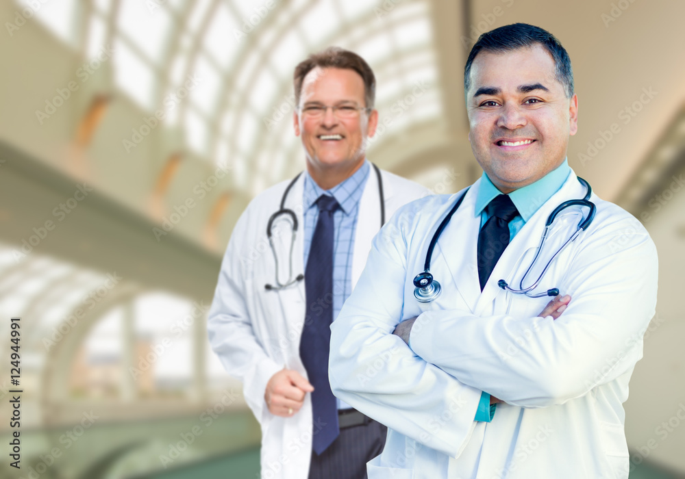 Handsome Male Doctors or Nurses Standing Inside Hospital Building. Handsome Male Doctors or Nurses Standing Inside Hospital Building.