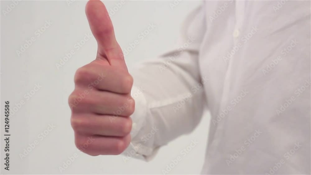 Thumbs up close-up on a white background Thumbs up close-up on a white background