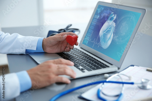 Cardiologist working with l...