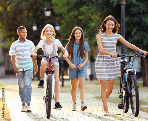 Friends riding bicycles and...