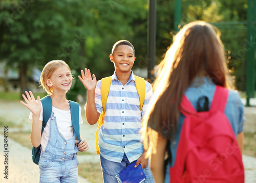 Teenagers with backpacks me...