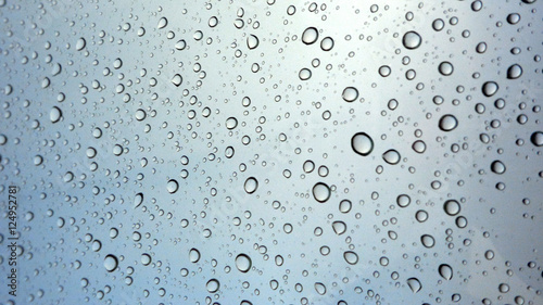 Close-up of water drops on glass surface as background