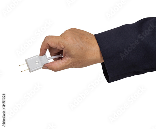 Hand holding electric plug isolated