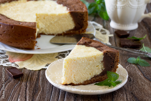 Cake with cream cheese and chocolate cheesecake on a table in a