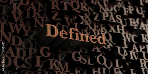 Defined - Wooden 3D rendered letters/message. Can be used for an online banner ad or a print postcard.