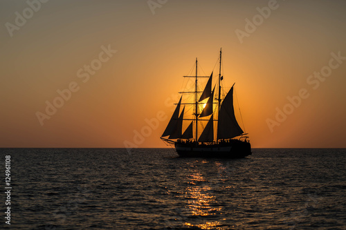 Silhouette of a Ship on the Sea at Sunset in Santorini