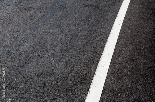 White line on new asphalt detail,Street with white line texture © rawintanpin