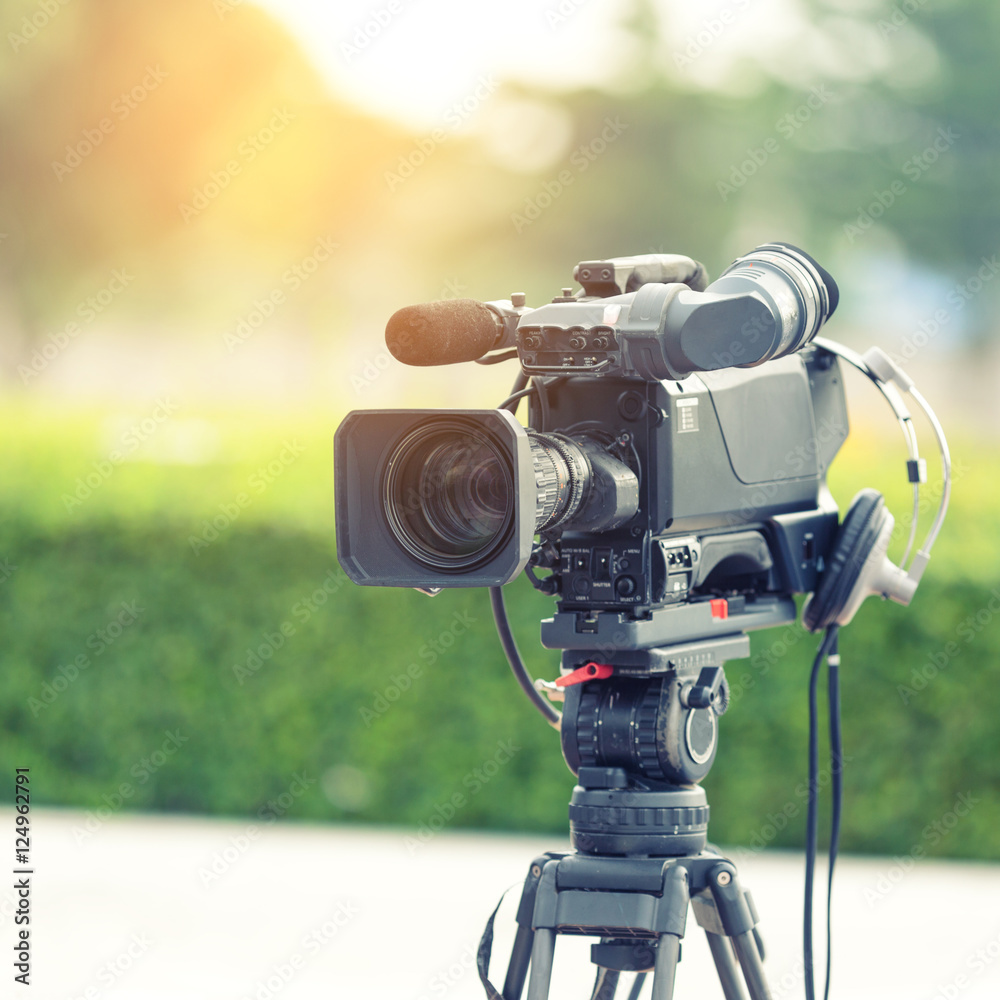 Naklejka premium Television camera recording publicity event.