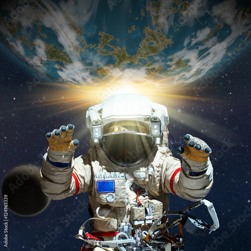 Fantasy scene of an Astronaut near an alien planet. Computer art & photo